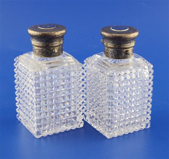 A pair of Victorian silver mounted hobnail cut glass scent bottles, 5.5in.